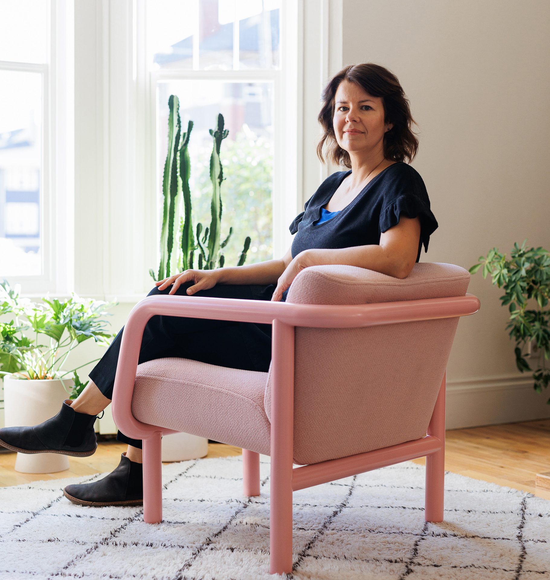 Nicole Marion at home in her Percy Lounge Chair